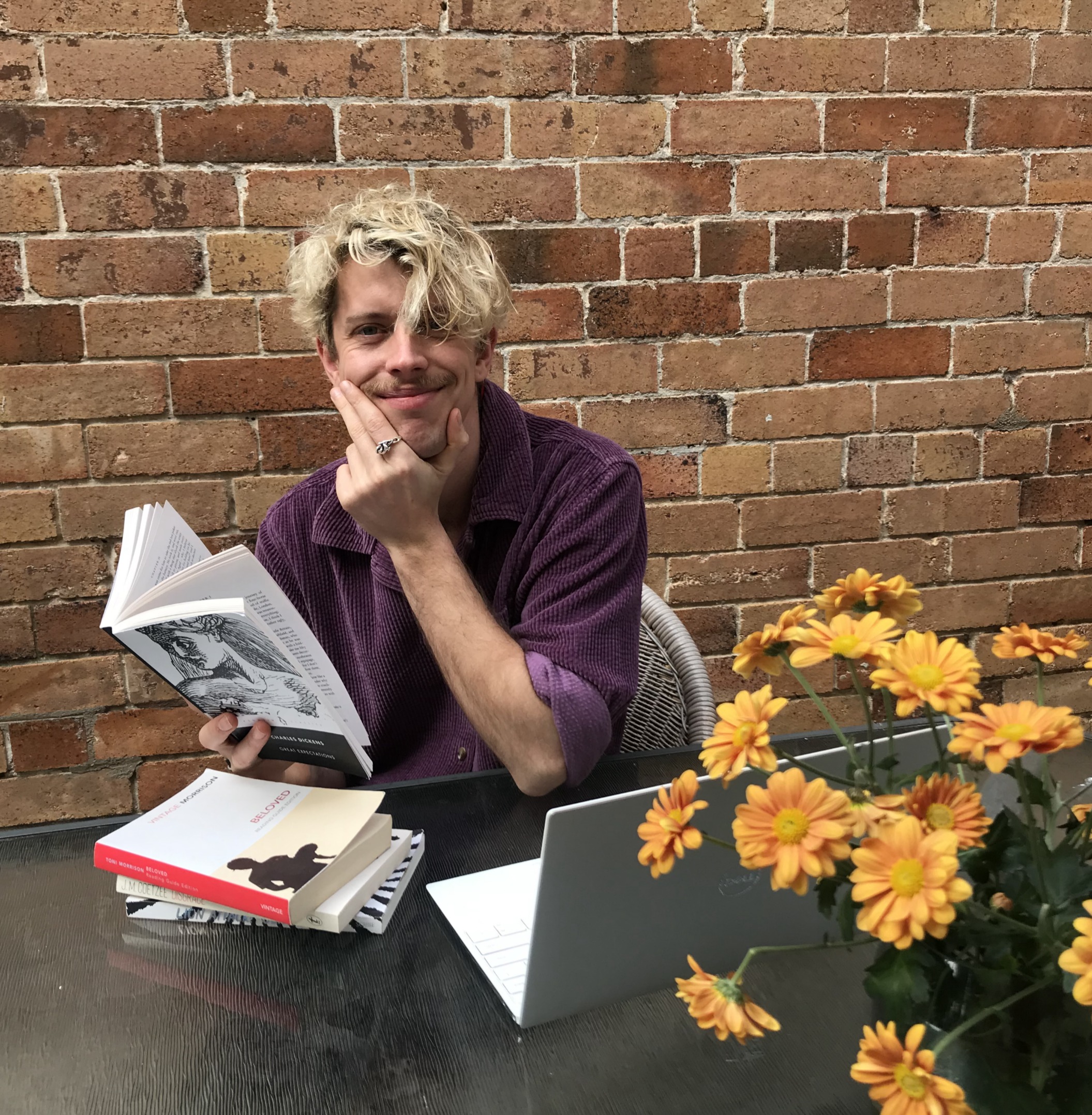 Sean Maroney at a desk with books